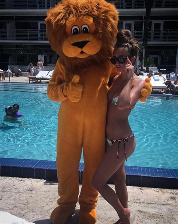 Megan McKenna with a lion mascot