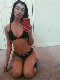 Anonymous in a bikini taking a selfie