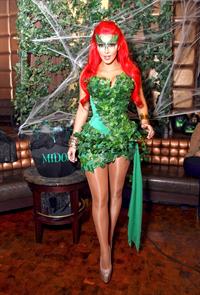 Kim Kardashian as Poison Ivy for the 2011 Midori Green Halloween party in New York