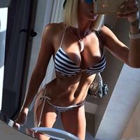 Alena Politukha in a bikini taking a selfie