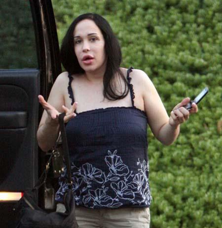 Nadya Suleman is better known as Octomom.  She was born Natalie Denise Suleman on July 11, 1975.  After 14 children she is stripping and making porn...

Candid picture of Octomom with her cell phone