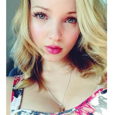Dove Cameron taking a selfie