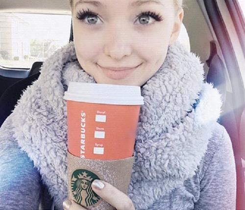 Dove Cameron taking a selfie