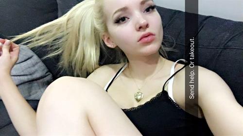 Dove Cameron taking a selfie