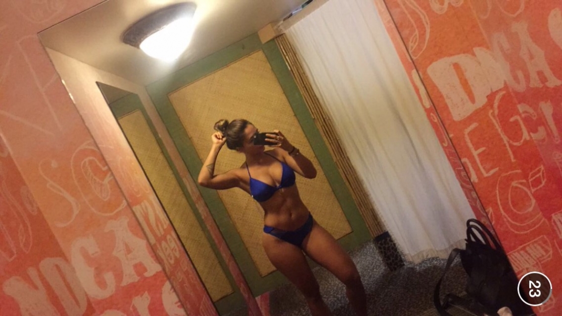 Tianna Gregory in a bikini taking a selfie