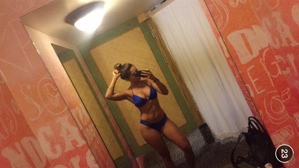 Tianna Gregory in a bikini taking a selfie