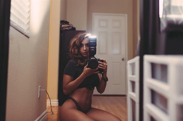 Tianna Gregory in a bikini taking a selfie