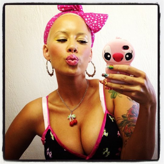 Amber Rose in a bikini taking a selfie