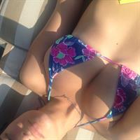 Emily Ratajkowski in a bikini taking a selfie