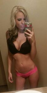 Anonymous in lingerie taking a selfie