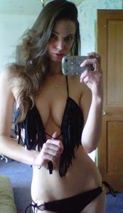 Kassie Lyn Logsdon in a bikini taking a selfie