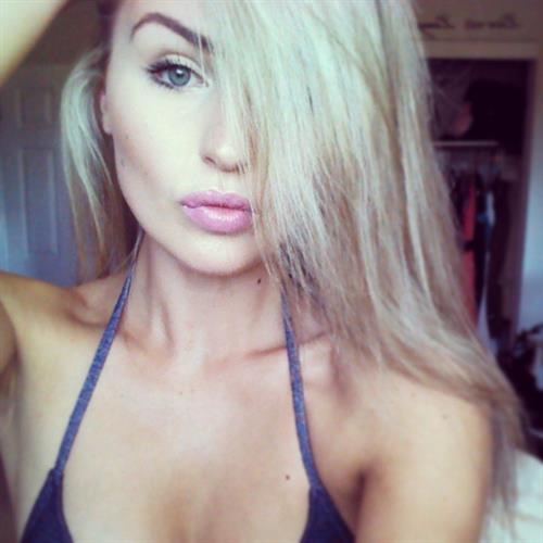 Mackenzie White in a bikini taking a selfie