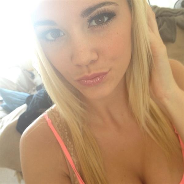 Caitlin Arnett in a bikini taking a selfie