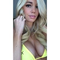 Caitlin Arnett in a bikini taking a selfie