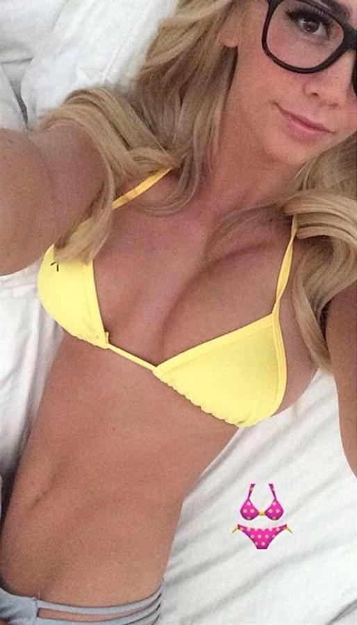 Caitlin Arnett in a bikini taking a selfie