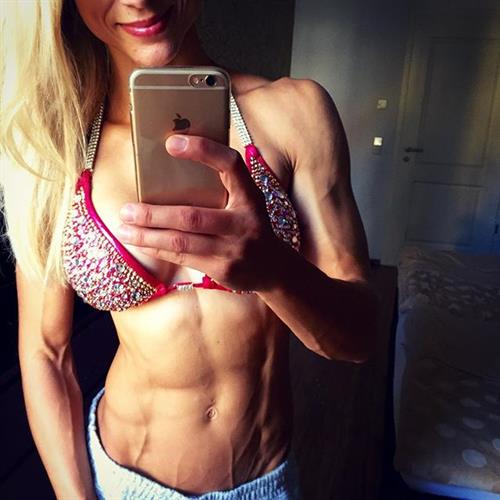 Adrienne Koleszár in a bikini taking a selfie