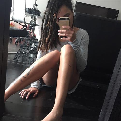 Sasha Lane taking a selfie