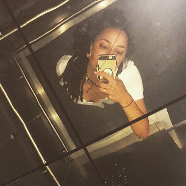 Sasha Lane taking a selfie