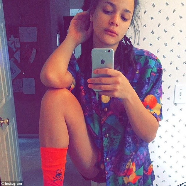 Sasha Lane taking a selfie