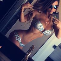 Sheala Foster in a bikini taking a selfie