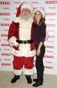 Audrina Patridge poses with Santa Claus