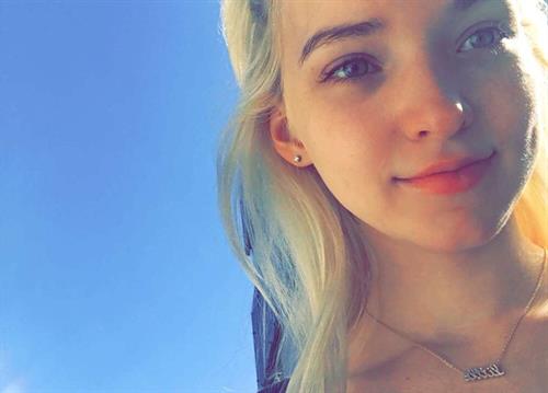 Dove Cameron taking a selfie
