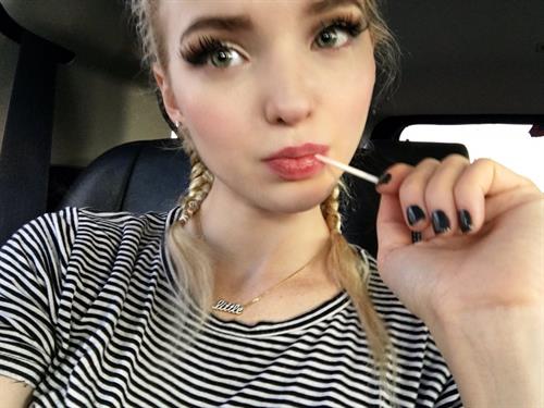 Dove Cameron taking a selfie