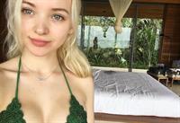 Dove Cameron in a bikini taking a selfie