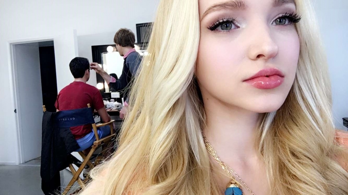 Dove Cameron taking a selfie