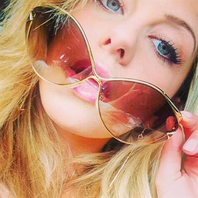 Audrey Allen taking a selfie and - breasts