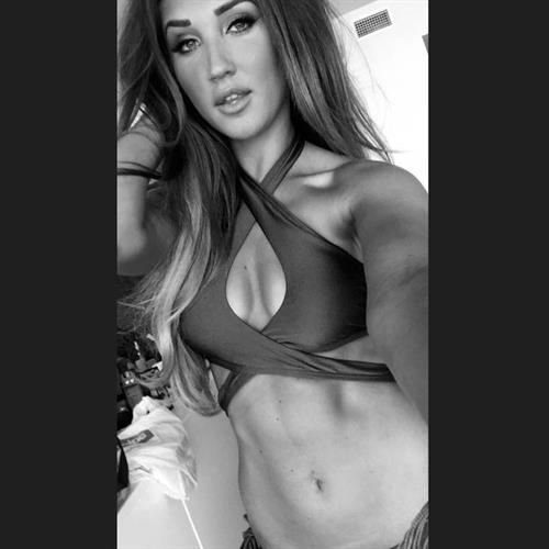 Megan McKenna in a bikini taking a selfie