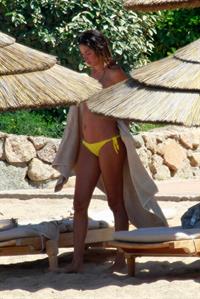 Aida Yespica - Yellow bikini candids in Sardinia on June 18, 2012