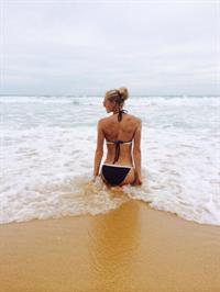 Darya Klishina in a bikini - ass