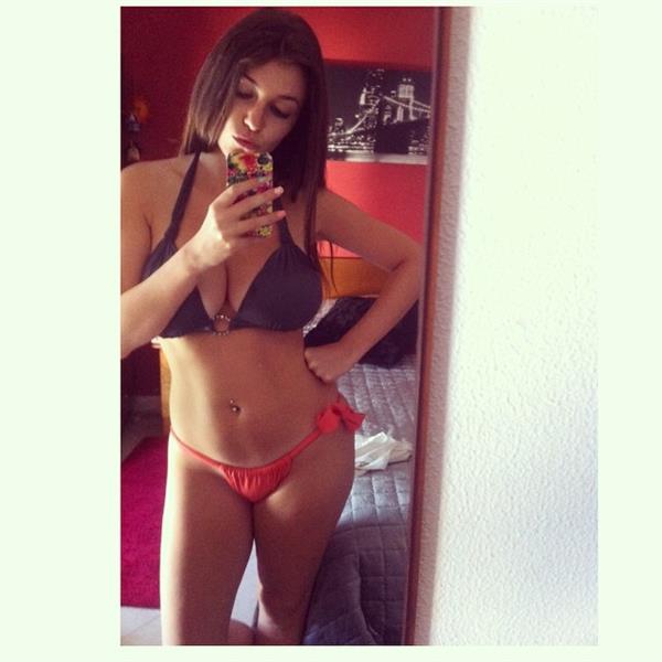 Carolina Neto in a bikini taking a selfie