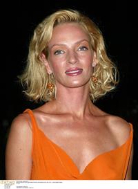 Uma Thurman in an orange dress