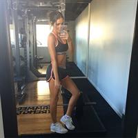 Kayla Itsines taking a selfie