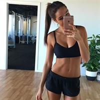 Kayla Itsines taking a selfie