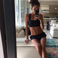 Kayla Itsines taking a selfie