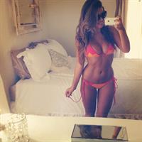 Natasha Oakley in a bikini taking a selfie