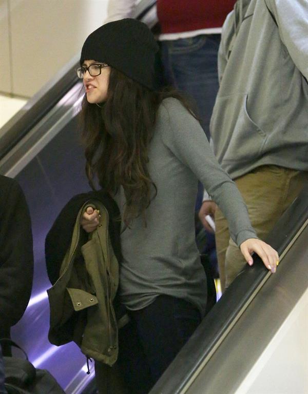 Selena Gomez arrives on a flight at Los Angeles Airport December 21, 2012 