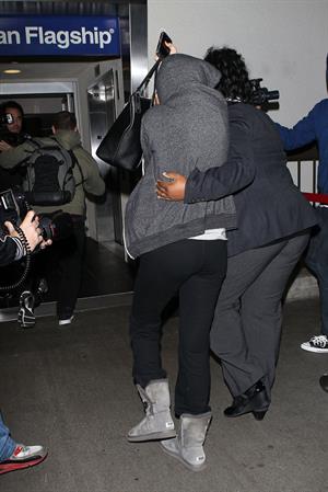 Selena Gomez departing out of LA, hiding her face