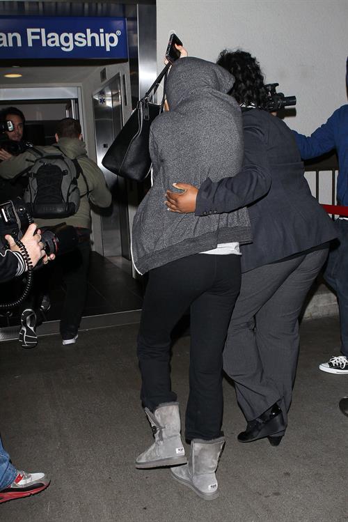 Selena Gomez Pictures Selena Gomez departing out of LA, hiding her face