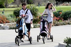 Selena Gomez golfing on February 2, 2010