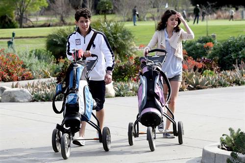 Selena Gomez golfing on February 2, 2010