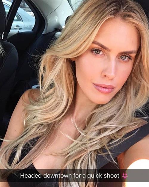 Kayla Rae Reid in a bikini taking a selfie