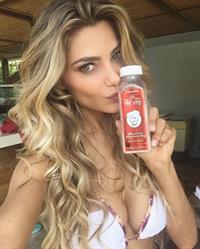 Karina Flores in a bikini taking a selfie