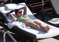 Kelly Brook bikini candids by the pool in Miami 2/1/13 