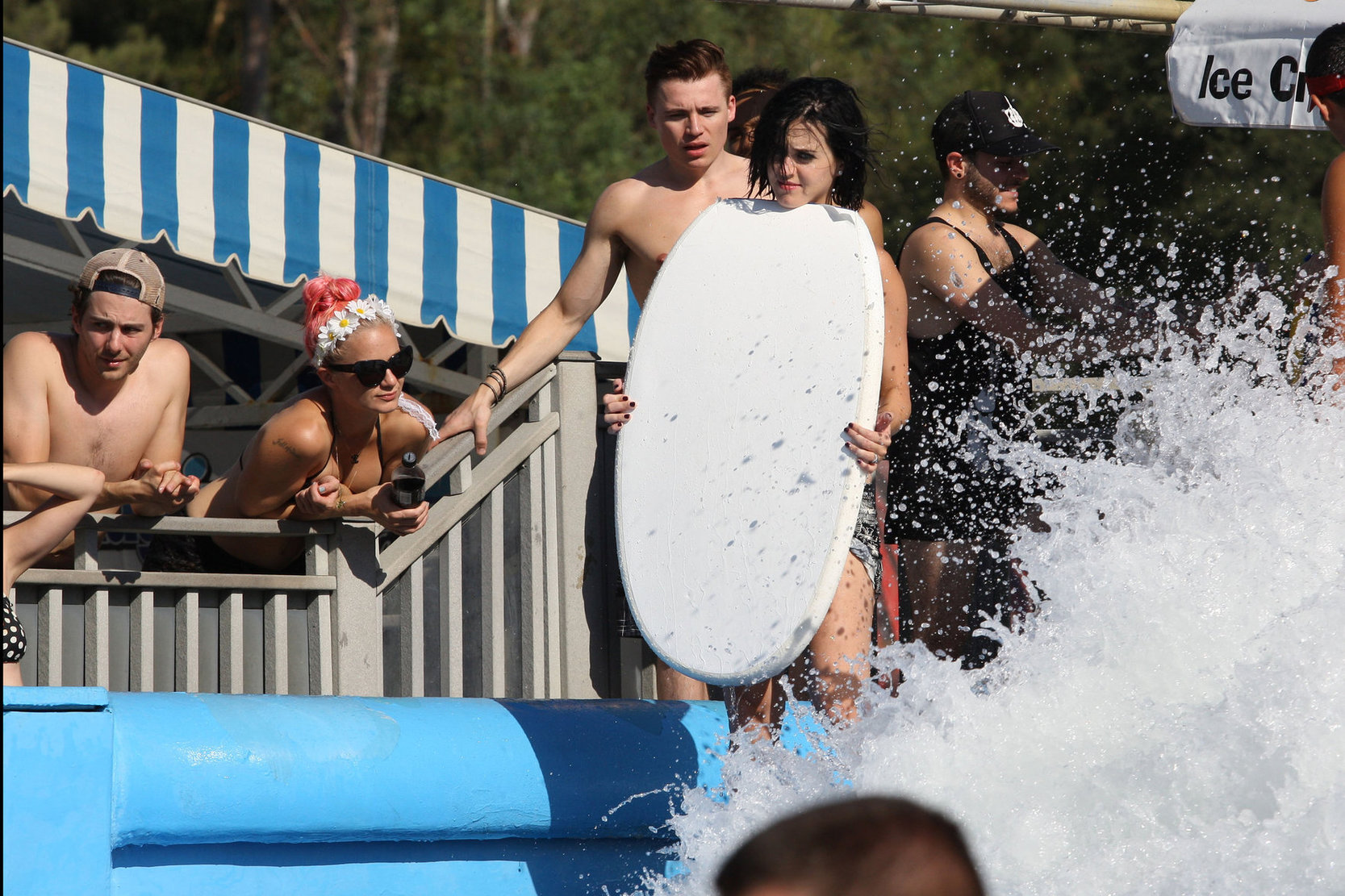 Katy Perry talks with a group of her friends after spending the afternoon at Raging Waters in San Dimas, California on August 12, 2012