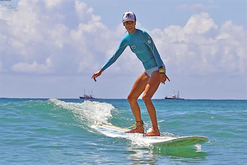 Alessandra Ambrosio surfing and eating a sno cone in Hawaii on October 12, 2011 