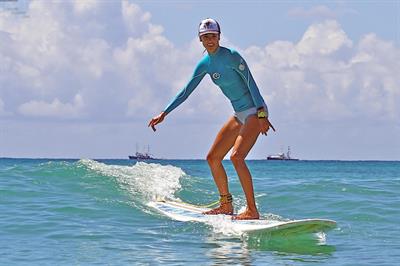Alessandra Ambrosio surfing and eating a sno cone in Hawaii on October 12, 2011 